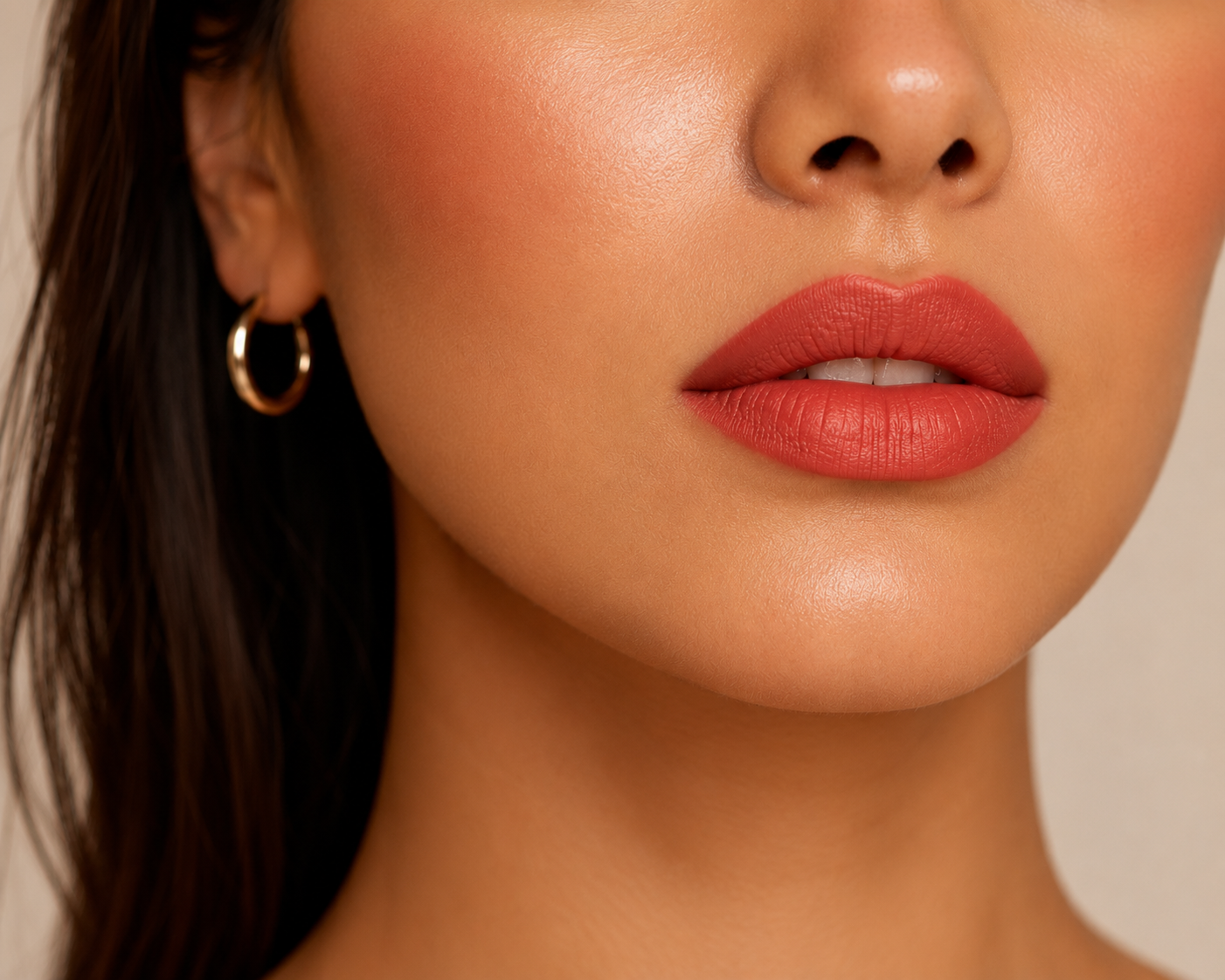 Woman with warm undertone skin wearing warm coral or terracotta lipstick